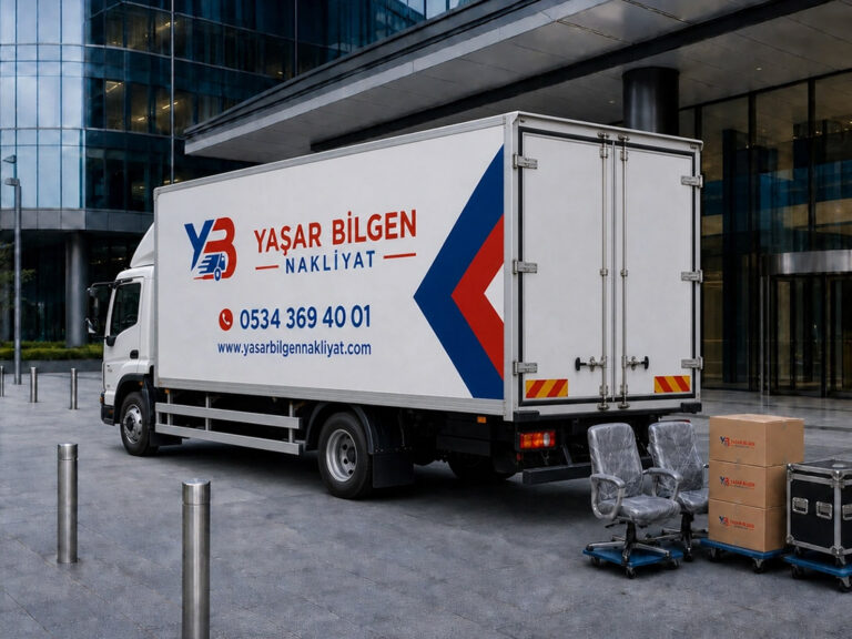 Modern bir bina önünde park etmiş Yaşar Bilgen Nakliyat yazılı beyaz kapalı kasa kamyonu.